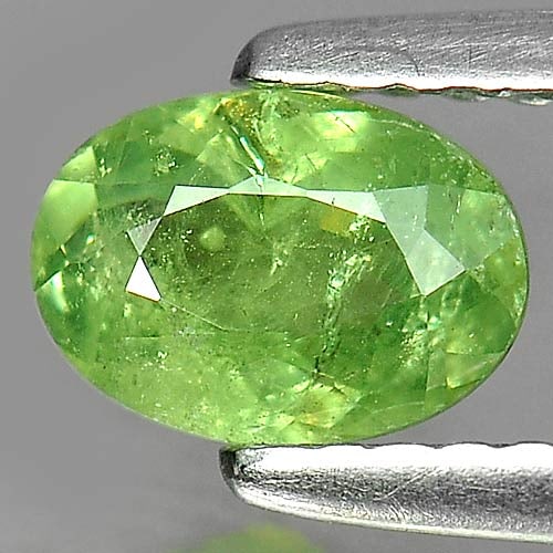 Natural Green Demantoid Garnet Gemstones 0.79 Ct. Oval Shape 6.7 x 4.7 Mm.: Product ID: 802919297 Product Name: Natural Demantoid Weight: 0.79 CT. Size: 6.7 x 4.7 x 2.9 MM. Shape: Oval Color: Green Clarity:SI Luster: Good Gems Origin: Madagascar , Africa Treatment: Unheated C
