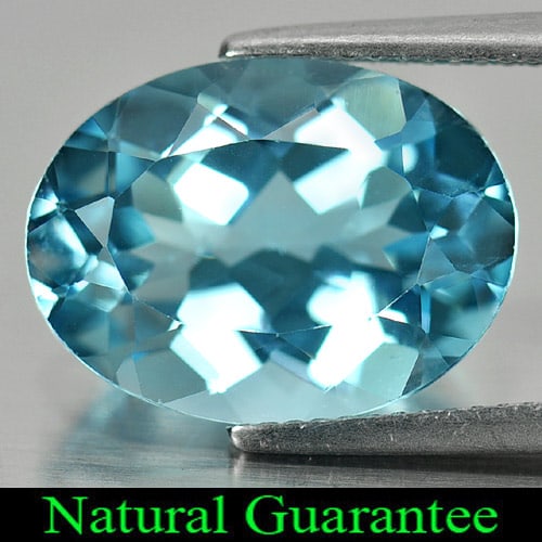 Natural Swiss Blue Topaz Gemstones 10.47 Ct. Oval Shape 16 x 12 Mm.: Product ID: 807158053 Product Name: Natural Blue Topaz Weight: 10.47 CT. Size: 16 x 12 x 7.6 MM. Shape: Oval Color: Swiss Blue Clarity:VSI Luster: Good Gems Origin: Brazil Treatment: Treated Crystal S
