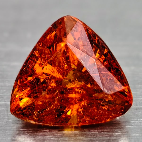 Natural Orange Spessatite Garnet Gemstones 0.52 ct. Trillant Shape 4.4 X 1.9 Mm.: Product ID: 102907970 Product Name: Natural Spessartine Weight: 0.52 CT. Size: 4.4 X 1.9 X 3.4 MM. Shape: Trillant Color: Orange Clarity:SI Luster: Good Gems Origin: Nigeria Treatment: Unheated Crysta