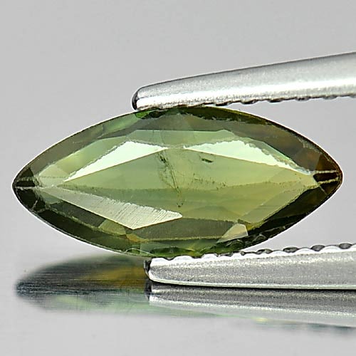 Natural Yellowish Green Sapphire Gemstones 0.93 Ct. Marquise Shape: Product ID: 806158886 Product Name: Natural Green Sapphire Weight: 0.93 CT. Size: 10.4 x 4.8 x 2 MM. Shape: Marquise Color: Green Clarity:VSI Luster: Good Gems Origin: Thailand Treatment: Heated Cryst