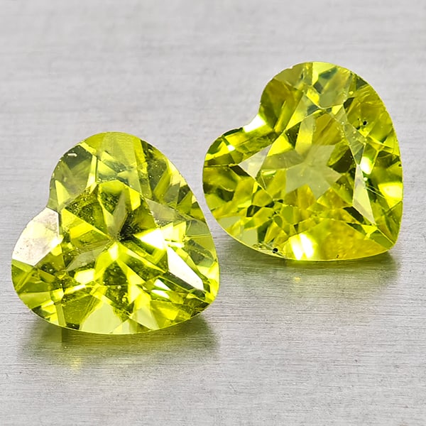 Natural Green Peridot Gemstones 1.69 Ct. 2 Pcs. Heart Shape 6 x 6 Mm.: Product ID: 805317324 Product Name: Natural Peridot Weight: 1.69 CT. Size: 6 x 6 x 3.5 MM. Shape: Heart Shape Color: Green Clarity:VSI - SI1 Luster: Good Gems Origin: Pakistan Treatment: Unheated Crys