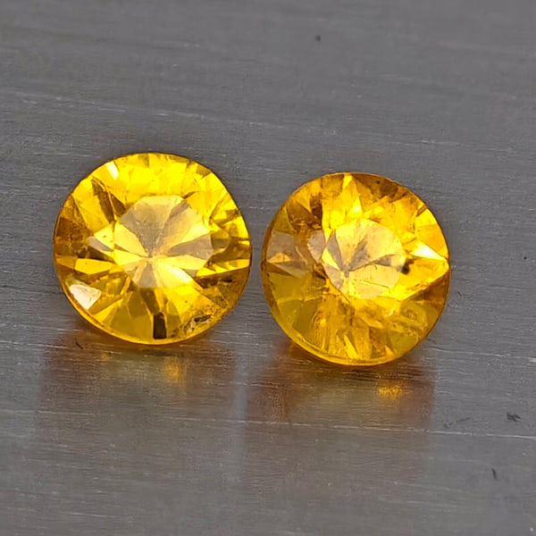 Natural Yellow Songea Sapphire Gemstones 0.37 Ct. 2 Pcs. Round Diamond Cut 3.4 Mm.: Product ID: 806130510 Product Name: Natural Blue Sapphire Weight: 0.37 CT. Size: 3.4 x 3.4 x 2.5 MM. Shape: Round Diamond Cut Color: Yellow Clarity:VSI Luster: Good Gems Origin: Tanzania Treatment: He