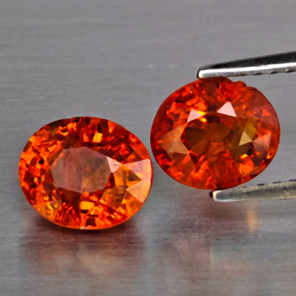 Natural Orangish Red Spessartine Garnet Gemstones 3.26 Ct. 2 Pcs. Oval Shape 7 x 6 Mm.: Product ID: 802937978 Product Name: Natural Garnet Weight: 3.26 CT. Size: 7 x 6 x 4.4 MM. Shape: Oval Color: Orangish Red Clarity:SI1 Luster: Good Gems Origin: Namibia Treatment: Unheated Crystal Stru