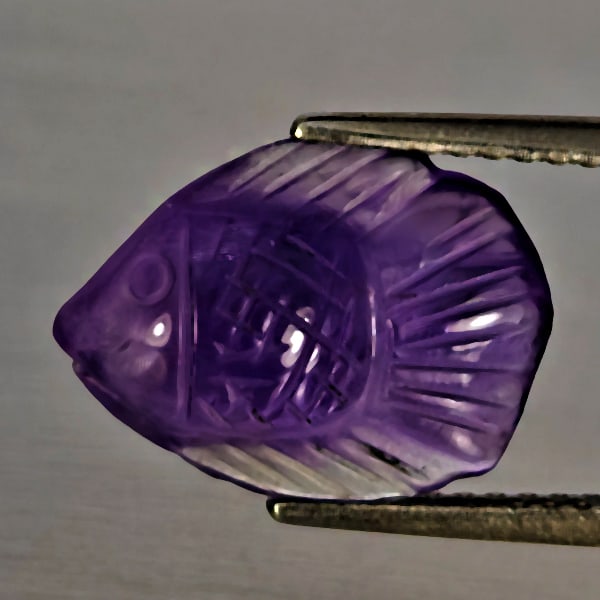 Natural Purple Amethyst Gemstones 3.05 Ct. Fish Carving 13.2 x 9.7 Mm.: Product ID: 810304006 Product Name: Natural Amethyst Weight: 3.05 CT. Size: 13.2 x 9.7 x 5.1 MM. Shape: Fish Carving Color: Purple Clarity:Semi - Transparent Luster: Good Gems Origin: Brazil Treatment