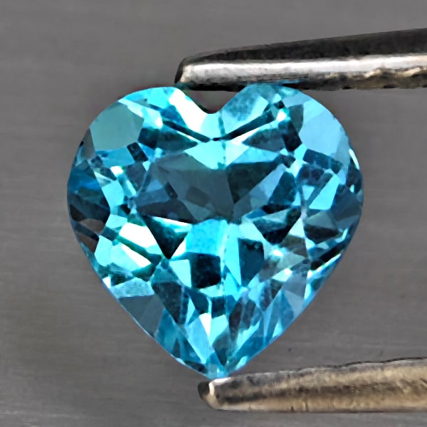 Natural Swiss Blue Topaz Gemstones 0.91Ct. Heart Shape 6.1 x 6 Mm.: Product ID: 807168026 Product Name: Natural Blue Topaz Weight: 0.91 CT. Size: 6.1 x 6 x 3.9 MM. Shape: Heart Shape Color: Swiss Blue Clarity:VSI - SI1 Luster: Good Gems Origin: Brazil Treatment: Treat
