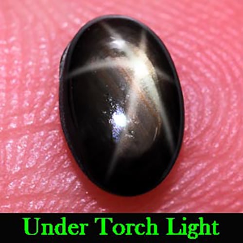 Natural Black Star Sapphire Gemstones 6 Rays 0.94 Ct. Oval Cabochon Shape 7.3 x 4.7 Mm.: Product ID: 806134725 Product Name: Natural Star Sapphire Weight: 0.94 CT. Size: 7.3 x 4.7 x 2.5 MM. Shape: Oval Cabochon Color: Black Clarity:Opaque Luster: Good 6 Rays Star Gems Origin: Thailand Tre