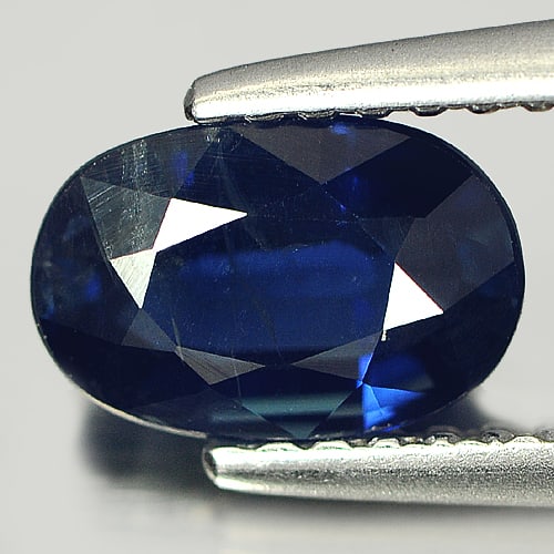 Natural Blue Sapphire Gemstones 1.38 Ct. Oval Shape 7.7 x 5.2 Mm.: Product ID: 806005589 Product Name: Natural Blue Sapphire Weight: 1.38 CT. Size: 7.7 x 5.2 x 3.6 MM. Shape: Oval Color: Blue Clarity:SI Luster: Good Gems Origin: Thailand Treatment: Heated Crystal Str