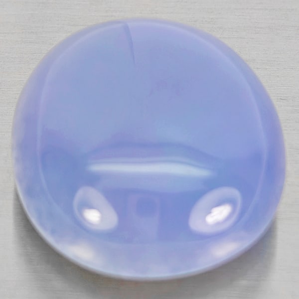 Natural Lavender Chalcedony Gemstones 31.76 Ct. Oval Cabochon Shape 22 x 19 Mm.: Product ID: 801502703 Product Name: Natural Chalcedony Weight: 31.76 CT. Size: 22 x 19 x 10.5 MM. Shape: Oval Cabochon Color: Lavender Clarity:Semi - Transparent Luster: Good Gems Origin: Russia Treat