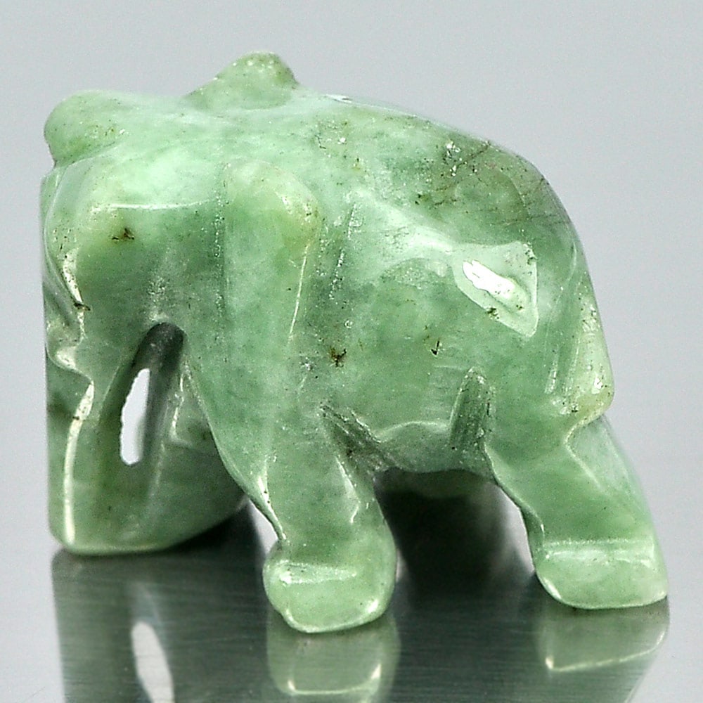 Natural Green Jade 55.16 Ct. Elephant Carving Shape 24 x 18 Mm.: Product ID: 819812700 Product Name: Natural Jade Weight: 55.16 CT. Size: 24 x 18 x 15 MM. Shape: Elephant Carving Color: Green Clarity:Opaque Luster: Good Gems Origin: Thailand Treatment: Unheated Cry