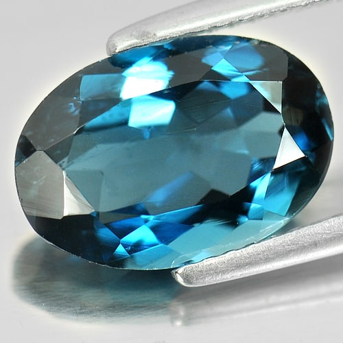 Natural London Blue Topaz Gemstones 4.35 Ct. Oval Shape 12.7 x 8.4 Mm.: Product ID: 807155788 Product Name: Natural Blue Topaz Weight: 4.35 CT. Size: 12.7 x 8.4 x 5.4 MM. Shape: Oval Color: London Blue Clarity:SI Luster: Good Gems Origin: Brazil Treatment: Treated Crystal
