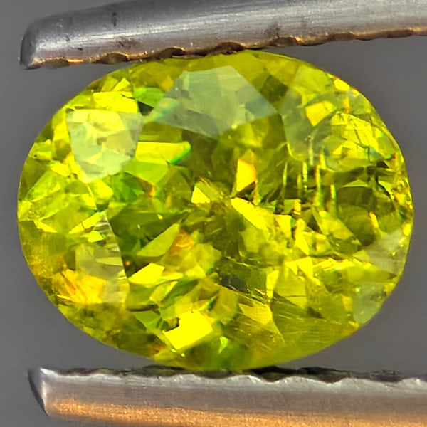 Natural Multi-Color Sphene Gemstones With Rainbow Spark 0.70 Ct. Oval Shape 6 x 5 Mm.: Product ID: 806509297 Product Name: Natural Sphene Weight: 0.70 CT. Size: 6 x 5 x 3.9 MM. Shape: Oval Color: Multi-Color Clarity:SI1 Luster: Good Gems Origin: Madagascar Treatment: Unheated Crystal St