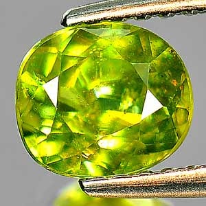 Natural Yellowish Green Titanium Sphene Gemstones With Rainbow Spark 0.98 Ct. Oval Shape 6.2 x 5.5: Product ID: 806506897 Product Name: Natural Sphene Weight: 0.98 CT. Size: 6.2 x 5.5 x 3.6 MM. Shape: Oval Color: Yellowish Green With Rainbow Spark Clarity:VSI Luster: Adamantine Gems Origin: Madagasc