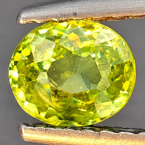 Natural Multi-Color Sphene Gemstones With Rainbow Spark 0.69 Ct. Oval Shape 5.7 x 4.9 Mm.: Product ID: 806509301 Product Name: Natural Sphene Weight: 0.69 CT. Size: 5.7 x 4.9 x 3.2 MM. Shape: Oval Color: Multi-Color Clarity:SI1 Luster: Good Gems Origin: Madagascar Treatment: Unheated Crysta