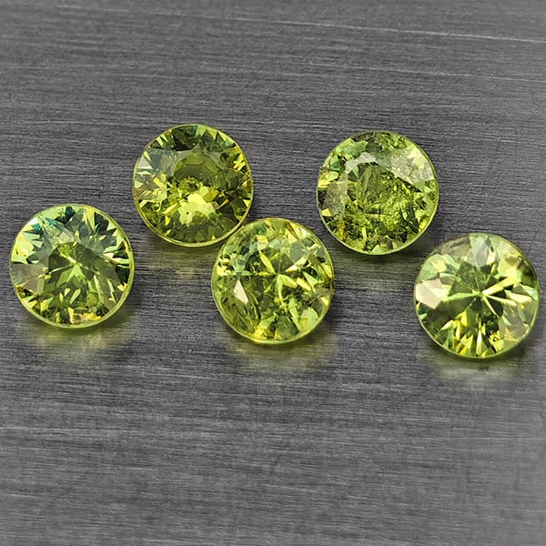 Natural Green Demantiod Garnet Gemstones 0.91 Ct. 5 Pcs. Round Diamond Cut 3.3 Mm.: Product ID: 802937632 Product Name: Natural Demantoid Weight: 0.91 CT. Size: 3.3 x 3.3 x 2.1 MM. Shape: Round Diamond Cut Color: Green Clarity:SI1 Luster: Good Gems Origin: Madagascar Treatment: Unhea
