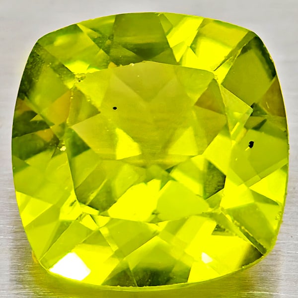 Natural Green Peridot Gemstones 1.35 Ct. Cushion Shape 7.1 Mm.: Product ID: 805317266 Product Name: Natural Peridot Weight: 1.35 CT. Size: 7.1 x 7.1 x 3.8 MM. Shape: Cushion Shape Color: Green Clarity:VSI - SI1 Luster: Good Gems Origin: Pakistan Treatment: Unheate