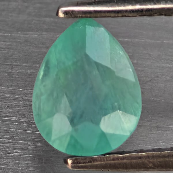 Natural Green Blueish Grandidierite Gemstones 1.25 Ct. Pear Shape 6.8 x 5.4 Mm.: Product ID: 803100105 Product Name: Natural Tsavorite Weight: 1.25 CT. Size: 6.8 x 5.4 x 4 MM. Shape: Pear Color: Green Blueish Clarity:SI1 Luster: Good Gems Origin: Madagascar Treatment: Unheated Cry