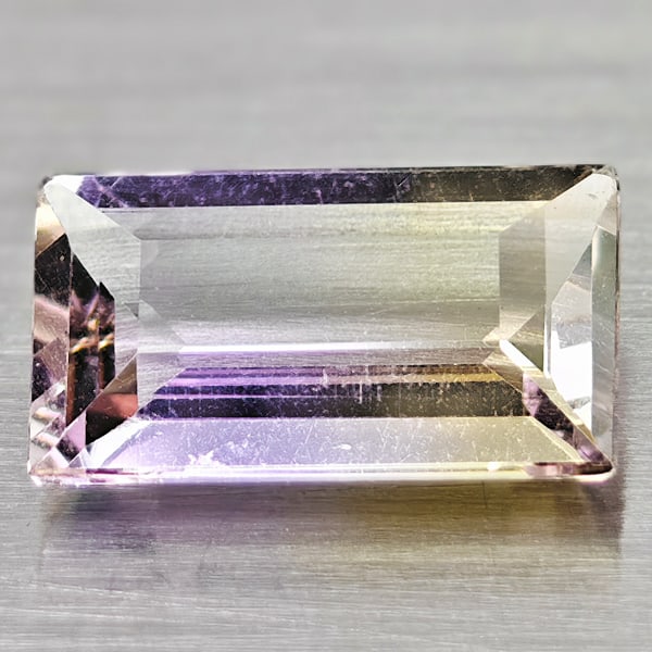 Natural Gem Bi - Color Ametrine Gemstones 1.57 Ct. Baguette Shape 5.8 X 9.8 Mm.: Product ID: 100400808 Product Name: Natural Ametrine Weight: 1.57 CT. Size: 5.8 X 9.8 X 3 MM. Shape: Baguette Color: Bi - Color Clarity:VVS Luster: Good Gems Origin: Brazil Treatment: Unheated Crystal