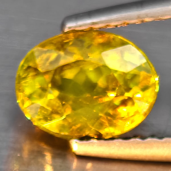 Natural Multi-Color Sphene Gemstones With Rainbow Spark 1.26 Ct. Oval Shape 7.2 x 5.5 Mm.: Product ID: 806509101 Product Name: Natural Sphene Weight: 1.26 CT. Size: 7.2 x 5.5 x 4.3 MM. Shape: Oval Shape Color: Multi-Color Clarity:SI1 Luster: Good Gems Origin: Madagascar Treatment: Unheated 