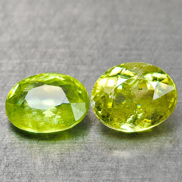 Natural Multi Color Sphene Gemstones Green Red Spark 1.52 Ct. 2 Pcs. Oval Shape and Mixed Size: Product ID: 806509009 Product Name: Natural Sphene Weight: 1.52 CT. Size: 6.1 x 5 x 3.7 to 6.1 x 4.7 x 2.7 MM. Shape: Oval Color: Intense Yellow Green With Red Spark Clarity:SI Luster: Good Gems Origi
