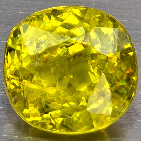 Natural Multi-Color Sphene Gemstones With Rainbow Spark 1.43 Ct. Round Shape 6.3 Mm.: Product ID: 806509090 Product Name: Natural Sphene Weight: 1.43 CT. Size: 6.3 x 6.3 x 4.6 MM. Shape: Round Shape Color: Multi-Color Clarity:SI1 Luster: Good Gems Origin: Madagascar Treatment: Unheated