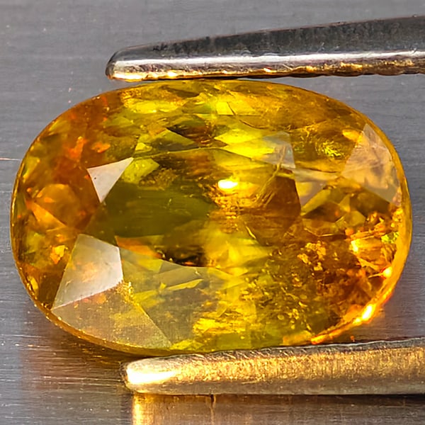 Natural Multi Color Sphene Gemstones Rainbow Spark 1.57 Ct. Oval Shape 8.4 x 5.9 Mm.: Product ID: 806509080 Product Name: Natural Sphene Weight: 1.57 CT. Size: 8.4 x 5.9 x 4.3 MM. Shape: Oval Color: Multi-Color Clarity:SI1 Luster: Good Gems Origin: Madagascar Treatment: Unheated Crysta