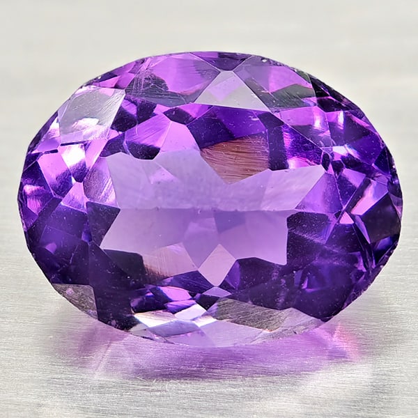 Natural Purple Amethyst Gemstones 5.09 Ct. Oval Shape 12.5 x 9.7 Mm.: Product ID: 800325394 Product Name: Natural Amethyst Weight: 5.09 CT. Size: 12.5 x 9.7 x 7.2 MM. Shape: Oval Color: Purple Clarity:VSI Luster: Good Gems Origin: Brazil Treatment: Unheated Crystal Stru