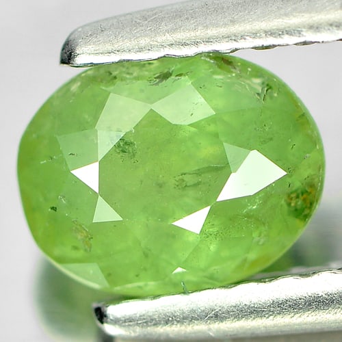 Natural Green Demantoid Garnet Gemstones 1.12 Ct. Oval Shape 6.6 x 5.3 Mm.: Product ID: 802919256 Product Name: Natural Demantoid Weight: 1.12 CT. Size: 6.6 x 5.3 x 3.9 MM. Shape: Oval Color: Green Clarity:SI Luster: Good Gems Origin: Madagascar , Africa Treatment: Unheated C