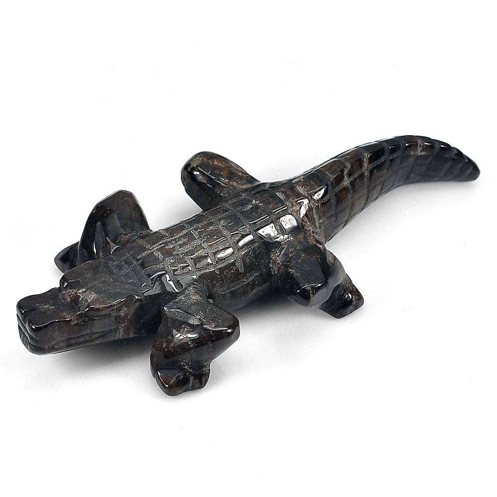 Natural Brown Color Petrified Wood Crocodile Carving 281.39 Ct.: Product ID: 819102090 Product Name: Natural Petrified Wood Weight: 281.39 CT. Size: 100 x 40 x 16.5 MM. Shape: Crocodile Carving Color: Brown Clarity:Opaque Luster: Very Good Gems Origin: Thailand Tre