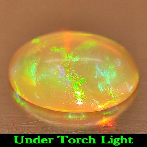 Natural Multi Color Opal Gemstones 0.71 Ct. Oval Cabochon Shape 8 x 5.8 Mm.: Product ID: 818725557 Product Name: Natural Opal Weight: 0.71 CT. Size: 8 x 5.8 x 3.3 MM. Shape: Oval Cabochon Color: Multi Color Clarity:Semi - Transparent Luster: Iridescent Gems Origin: Ethiopia Tr