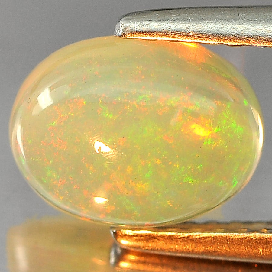 Natural Multi Color Opal Gemstone 1.30 Ct. Oval Cabochon Shape 8.8 x 6.7 Mm.: Product ID: 818727015 Product Name: Natural Opal Weight: 1.30 CT. Size: 8.8 x 6.7 x 4 MM. Shape: Oval Cabochon Color: Multi-Color Clarity:Semi - Transparent Luster: Iridescent Gems Origin: Ethiopia Tr