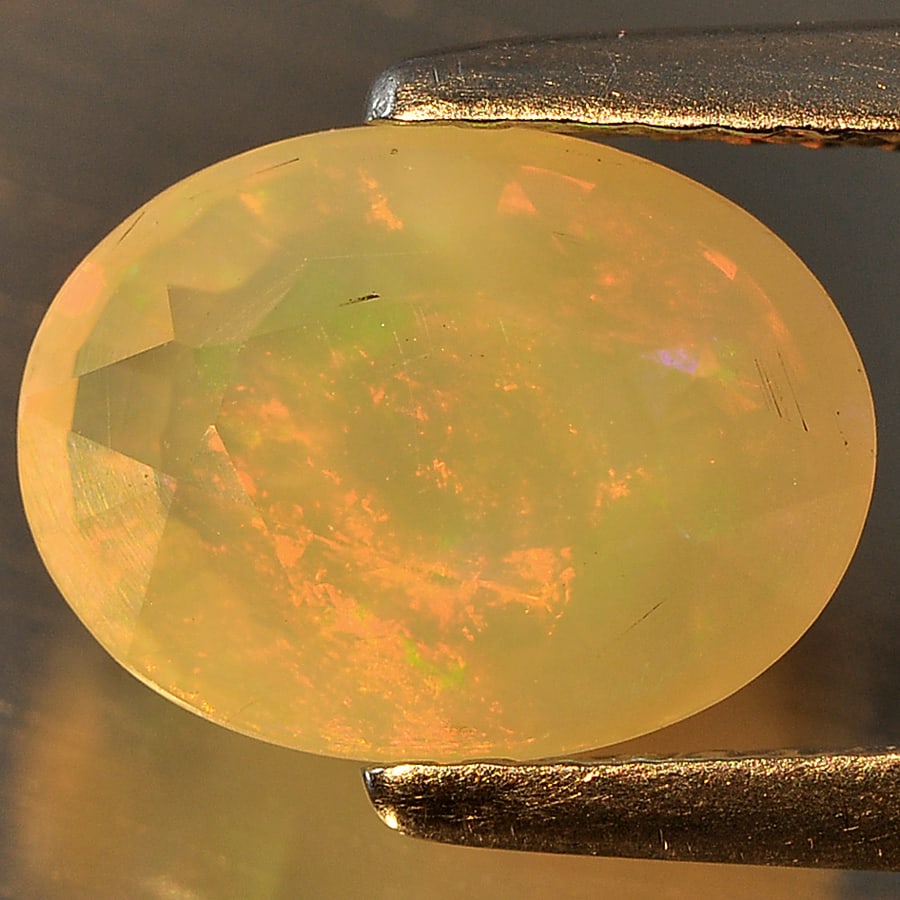 Natural Multi Color Opal Gemstones 1.46 Ct. Oval Shape 9.7 x 7.2 Mm. (1 of 3)