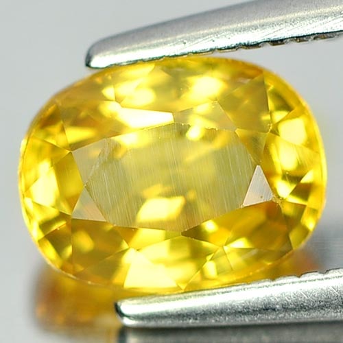 Natural Yellow Sapphire Gemstones 1.56 Ct. Oval Shape 7.2 x 5.6 x 4.1 Mm.: Product ID: 806150810 Product Name: Natural Yellow Sapphire Weight: 1.56 CT. Size: 7.2 x 5.6 x 4.1 MM. Shape: Oval Color: Yellow Clarity:VSI Luster: Very Good Gems Origin: Thailand Treatment: Heated C