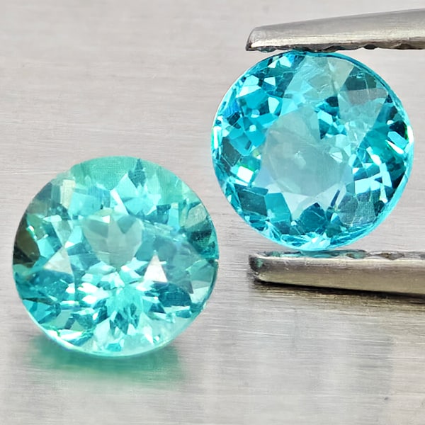 Natural Paraiba Color Apatite Gemstones 1.11 Ct. 2 Pcs. Round Shape 5 Mm.: Product ID: 800613665 Product Name: Natural Apatite Weight: 1.11 CT. Size: 5 x 5 x 3.4 MM. Shape: Round Shape Color: Paraiba Color Clarity:SI1 Luster: Good Gems Origin: Tanzania Treatment: Unheated Cr