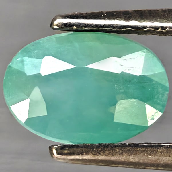 Natural Green Blueish Grandidierite Gemstones 1.30 Ct. Oval Shape 7 x 4.9 Mm.: Product ID: 803100109 Product Name: Natural Tsavorite Weight: 1.30 CT. Size: 7 x 4.9 x 4.1 MM. Shape: Oval Shape Color: Green Blueish Clarity:SI1 Luster: Good Gems Origin: Madagascar Treatment: Unheat