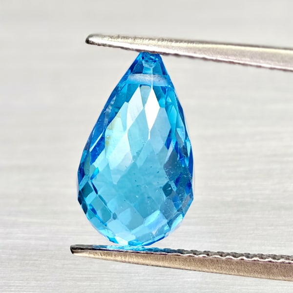 Natural Swiss Blue Topaz Gemstones 5.52 Ct. Briolette With Drilled 12.7 x 7.4 Mm.: Product ID: 807168054 Product Name: Natural Blue Topaz Weight: 5.52 CT. Size: 12.7 x 7.4 x 7.4 MM. Shape: Briolette With Drilled Color: Swiss Blue Clarity:VSI Luster: Good Gems Origin: Brazil Treatmen