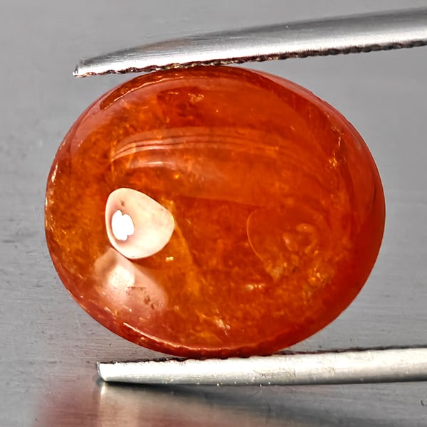Natural Orangish Red Spessartine Garnet Gemstones 11.66 Ct. Oval Cabochon Shape 13.8 x 12 Mm.: Product ID: 802938021 Product Name: Natural Garnet Weight: 11.66 CT. Size: 13.8 x 12 x 6.8 MM. Shape: Oval Cabochon Color: Orangish Red Clarity:SI1 Luster: Good Gems Origin: Namibia Treatment: Unheate