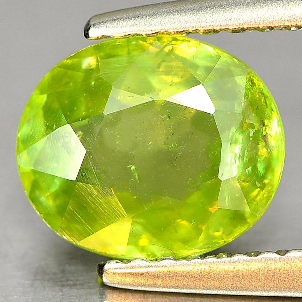 Natural Green Sphene Gemstones With Rainbow Spark 1.48 Ct. Oval Shape 7.9 x 6.6 Mm.: Product ID: 806507867 Product Name: Natural Sphene Weight: 1.48 CT. Size: x 3.3 MM. Shape: Oval Color: Green Clarity:SI1 Luster: Good Gems Origin: Madagascar Treatment: Unheated Crystal Structure: Mon