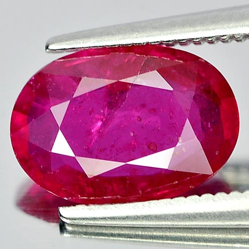 Natural Purplish Pink Ruby Gemstones 2.17 Ct. Oval Shape 9.9 x 6.9 Mm.: Product ID: 805920602 Product Name: Natural Ruby Weight: 2.17 CT. Size: 9.9 x 6.9 x 3.2 MM. Shape: Oval Color: Purple Pink Clarity:SI Luster: Good Gems Origin: Mozambique Treatment: Heated (Lead-glass
