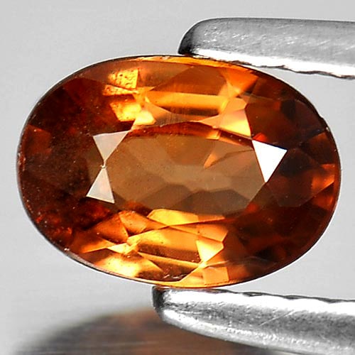 Natural Yellowish Brown Zircon Gemstones 0.89 Ct. Oval Shape 7 x 5 Mm.: Product ID: 807730584 Product Name: Natural Zircon Weight: 0.89 CT. Size: 7 x 5 x 2.5 MM. Shape: Oval Color: Yellowish Brown Clarity:SI1 Luster: Good Gems Origin: Cambodia Treatment: Heated Crystal St