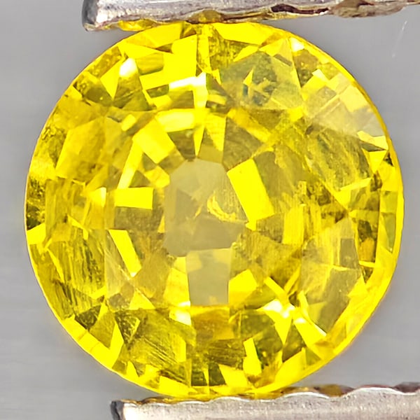 Natural Yellow Sapphire Gemstones 0.43 Ct. Round Shape 4.6 Mm.: Product ID: 806162801 Product Name: Natural Orange Sapphire Weight: 0.43 CT. Size: 4.6 x 4.6 x 2.6 MM. Shape: Round Shape Color: Yellow Clarity:VSI Luster: Good Gems Origin: Thailand Treatment: Heated