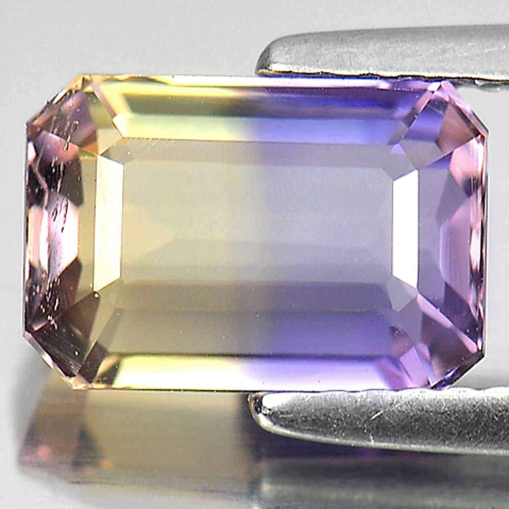 Natural Bi Color Ametrine Gemstones 2.56 Ct. Octagon Shape 9.4 x 6.5 Mm.: Product ID: 800405041 Product Name: Natural Ametrine Weight: 2.56 CT. Size: 9.4 x 6.5 x 5 MM. Shape: Octagon Color: Bi Color Clarity:VSI Luster: Good Gems Origin: Bolivia Treatment: Unheated Crystal S