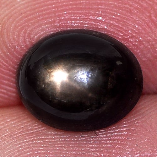 Natural Black Star Sapphire Gemstones 4.61 Ct. Oval Cabochon Shape 9.8 x 8 Mm.: Product ID: 806134484 Product Name: Natural Star Sapphire Weight: 4.61 CT. Size: 9.8 x 8 x 5.3 MM. Shape: Oval Cabochon Color: Black Clarity:Opaque Luster: Good 6 Rays Star Gems Origin: Thailand Treat