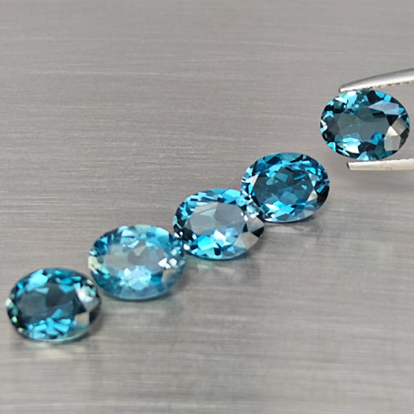 Natural London Blue Topaz Gemstones 10.40 Ct. 5 Pcs. Oval Shape 9.1 x 7.1 Mm.: Product ID: 807168954 Product Name: Natural Blue Topaz Weight: 10.40 CT. Size: 9.1 x 7.1 x 4.4 MM. Shape: Oval Color: London Blue Clarity:SI1 Luster: Good Gems Origin: Brazil Treatment: Treated Crysta