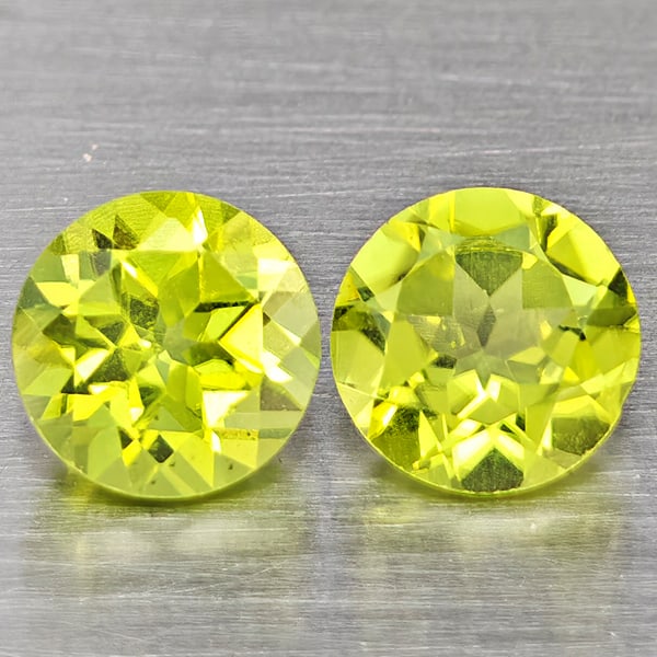Natural Green Peridot Gemstones 1.14 Ct. 2 Pcs. Round Shape 5.2 Mm.: Product ID: 805317602 Product Name: Natural Peridot Weight: 1.14 CT. Size: 5.2 x 5.2 x 3.5 MM. Shape: Round Color: Green Clarity:VSI Luster: Good Gems Origin: Pakistan Treatment: Unheated Crystal Stru
