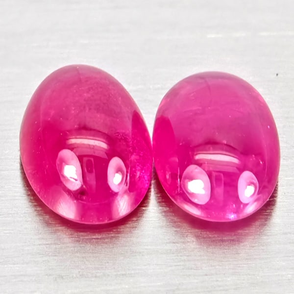 Natural Pink Red Jonson Ruby Gemstones 1.38 Ct. 2 Pcs. Oval Cabochon Shape 6 x 4.1 Mm.: Product ID: 805935793 Product Name: Natural Ruby Weight: 1.38 CT. Size: 6 x 4.1 x 2.8 MM. Shape: Oval Cabochon Color: Pink Red Clarity:Semi - Transparent Luster: Good Gems Origin: Mozambique Treatment