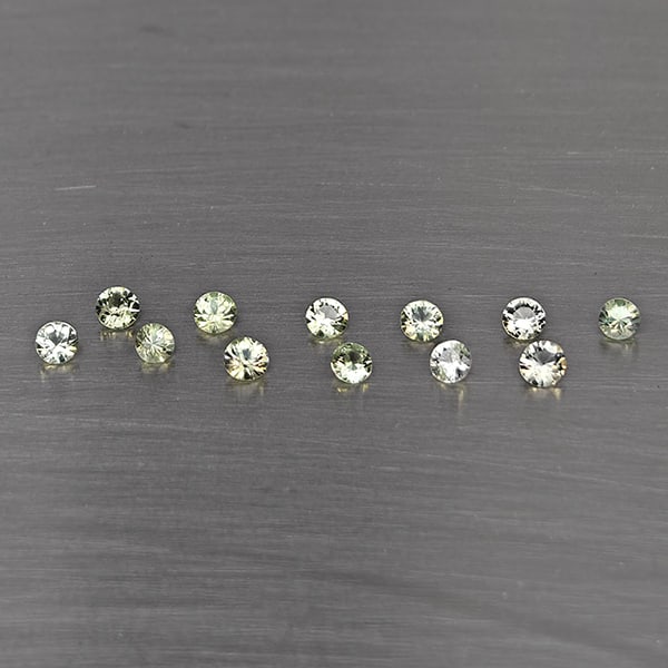 Natural Green Songea Sapphire Gemstones 0.74 Ct. 12 Pcs. Round Diamond Cut 2.4 Mm.: Product ID: 806130494 Product Name: Natural Blue Sapphire Weight: 0.74 CT. Size: 2.4 x 2.4 x 1.5 MM. Shape: Round Diamond Cut Color: Green Clarity:SI1 Luster: Good Gems Origin: Tanzania Treatment: Hea