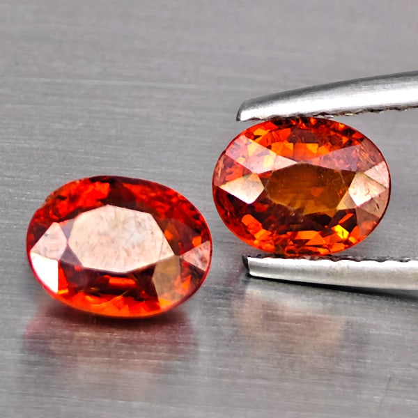 Natural Orangish Red Spessartine Garnet Gemstones 2.46 Ct. 2 Pcs. Oval Shape 7 x 5.5 Mm.: Product ID: 802937971 Product Name: Natural Garnet Weight: 2.46 CT. Size: 7 x 5.5 x 3.7 MM. Shape: Oval Color: Orangish Red Clarity:SI1 Luster: Good Gems Origin: Namibia Treatment: Unheated Crystal St