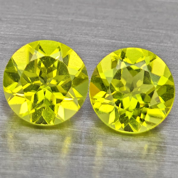 Natural Green Peridot Gemstones 1.59 Ct. 2 Pcs. Round Shape 5.2 Mm.: Product ID: 805317697 Product Name: Natural Weight: 1.59 CT. Size: 5.2 x 5.2 x 3.5 MM. Shape: Round Shape Color: Green Clarity:VSI Luster: Good Gems Origin: Pakistan Treatment: Unheated Crystal Struct