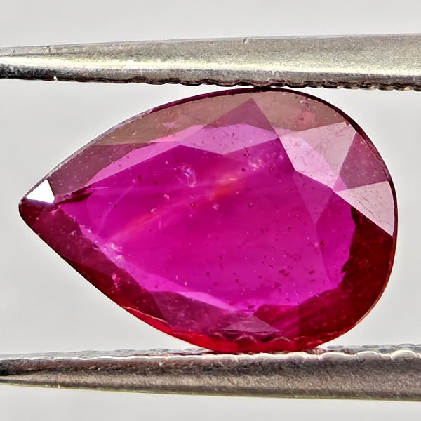 Natural Purplish Red Ruby Gemstones 1.54 Ct. Pear Shape 9.2 x 6.6 Mm.: Product ID: 805935583 Product Name: Natural Ruby Weight: 1.54 CT. Size: 9.2 x 6.6 x 2.7 MM. Shape: Pear Shape Color: Purplish Pink Clarity:VSI - SI1 Luster: Good Gems Origin: Madagascar Treatment: Hea
