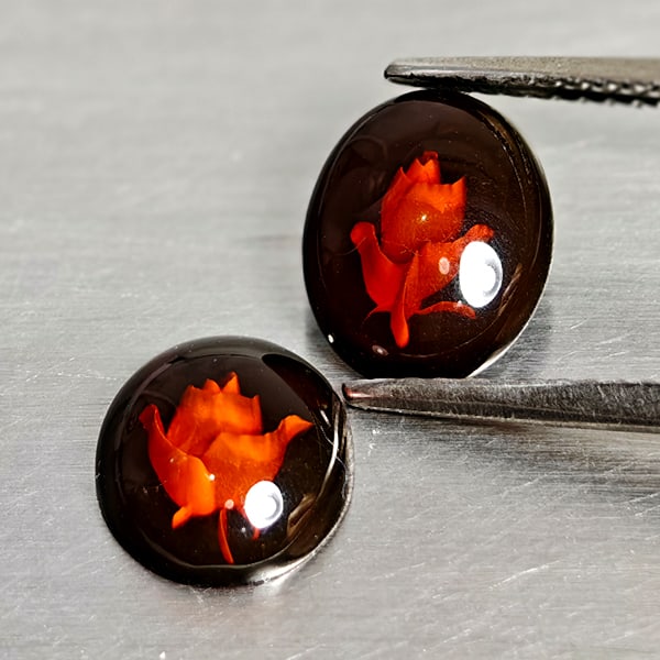 Natural Brown Yellow Amber 1.08 Ct. 2 Pcs. Flower Carving In Oval Cabochon Shape: Product ID: 819091074 Product Name: Natural Amber Weight: 1.08 CT. Size: 9.6 x 7.6 x 2.5 MM. Shape: Oval Cabochon Color: Brown Yellow Clarity:Semi - Transparent Luster: Good Gems Origin: Poland Treatm